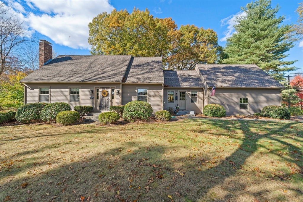 a front view of a house with a garden