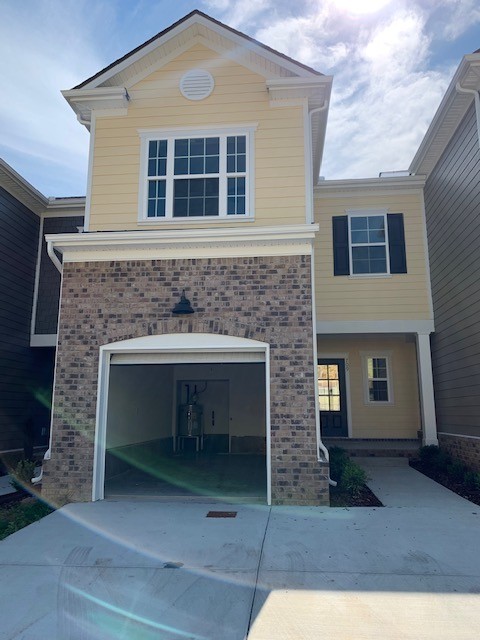 a front view of a house with yard