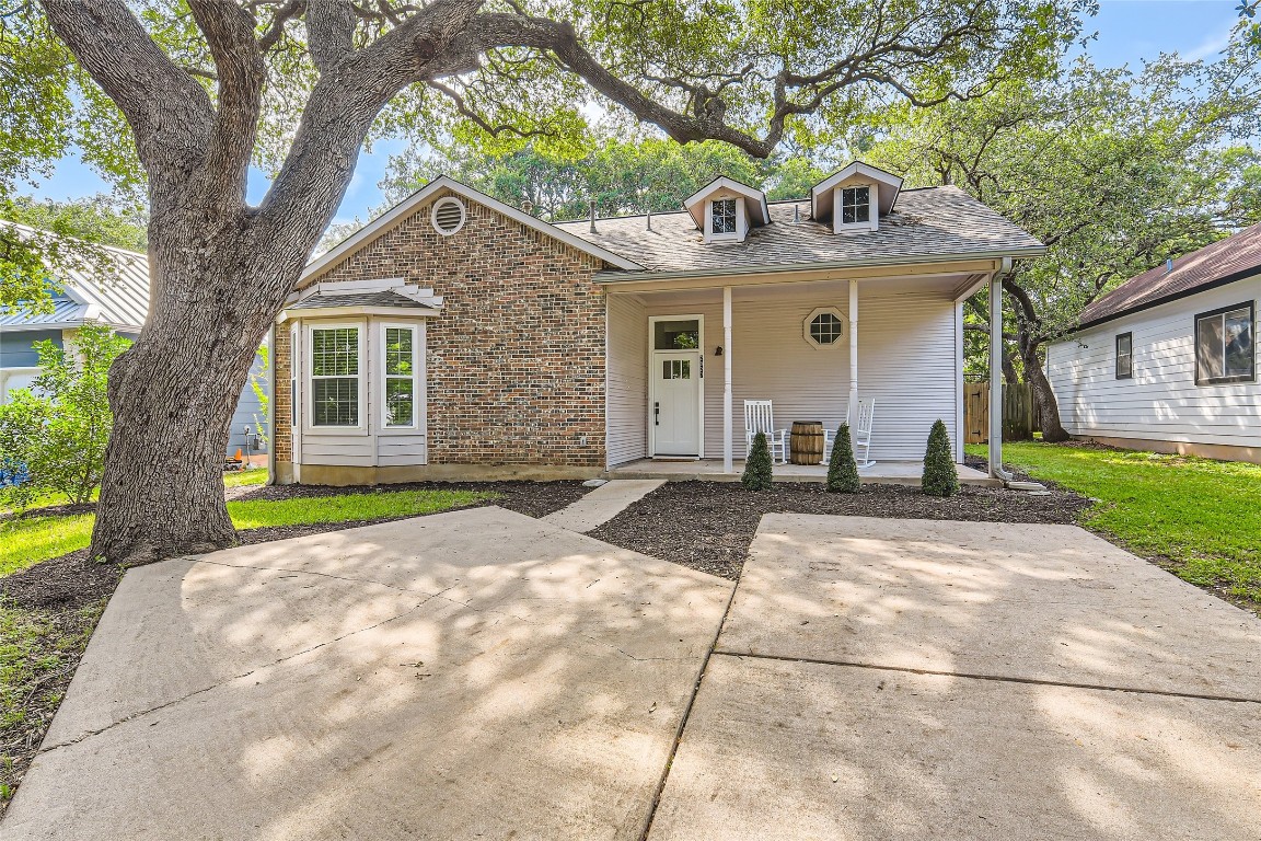 Adorable, cottage like home that oozes charm and character surrounded by beautiful mature oak trees