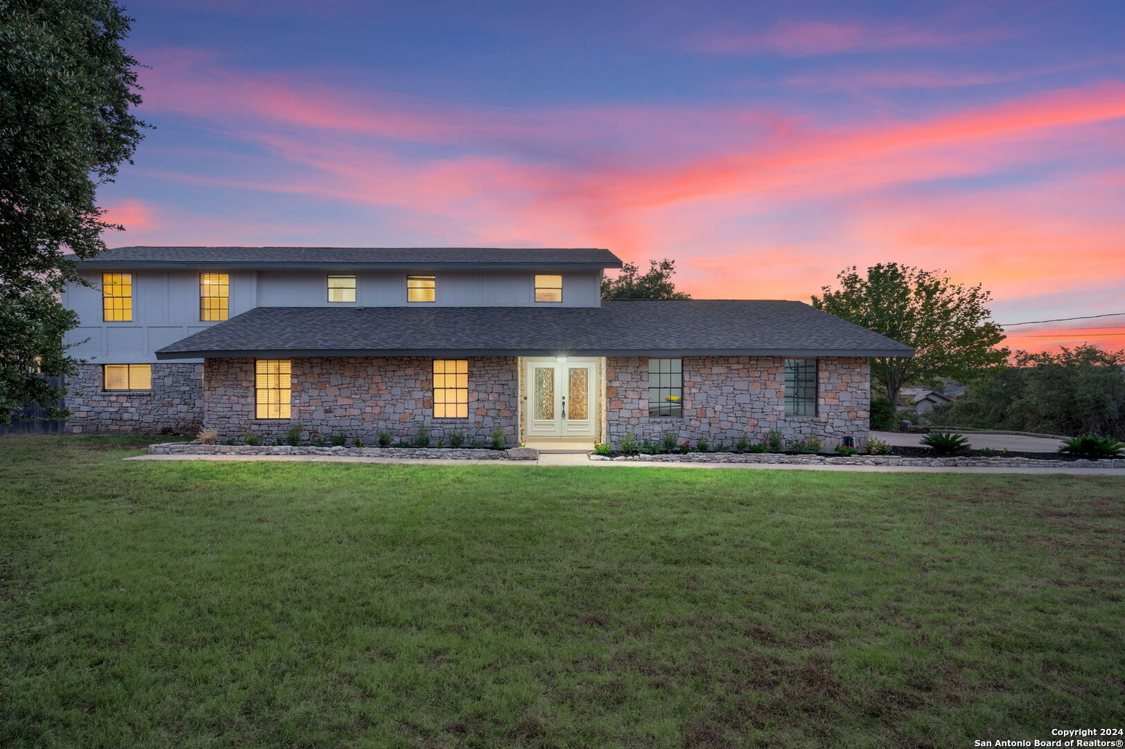 a front view of a house with a yard