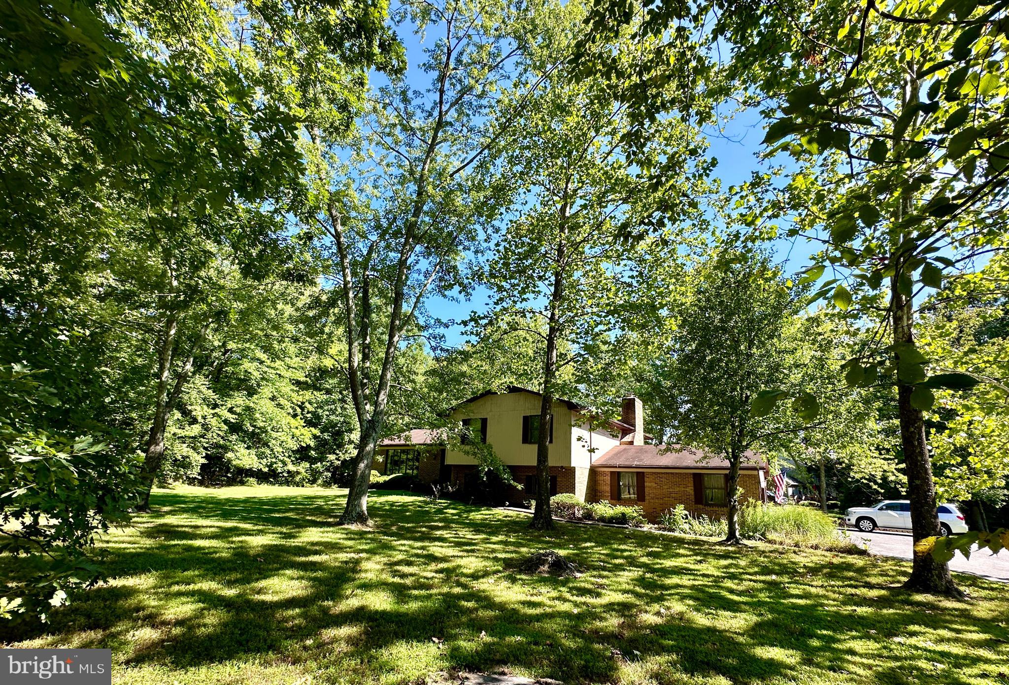 a backyard of a house with lots of green space