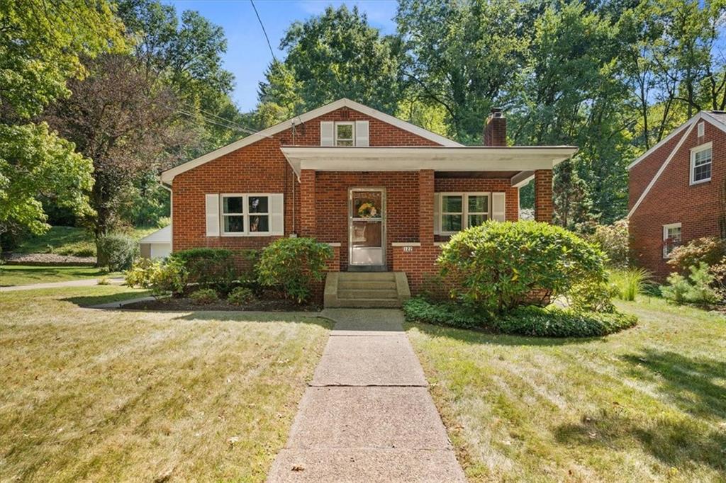 a front view of a house with yard