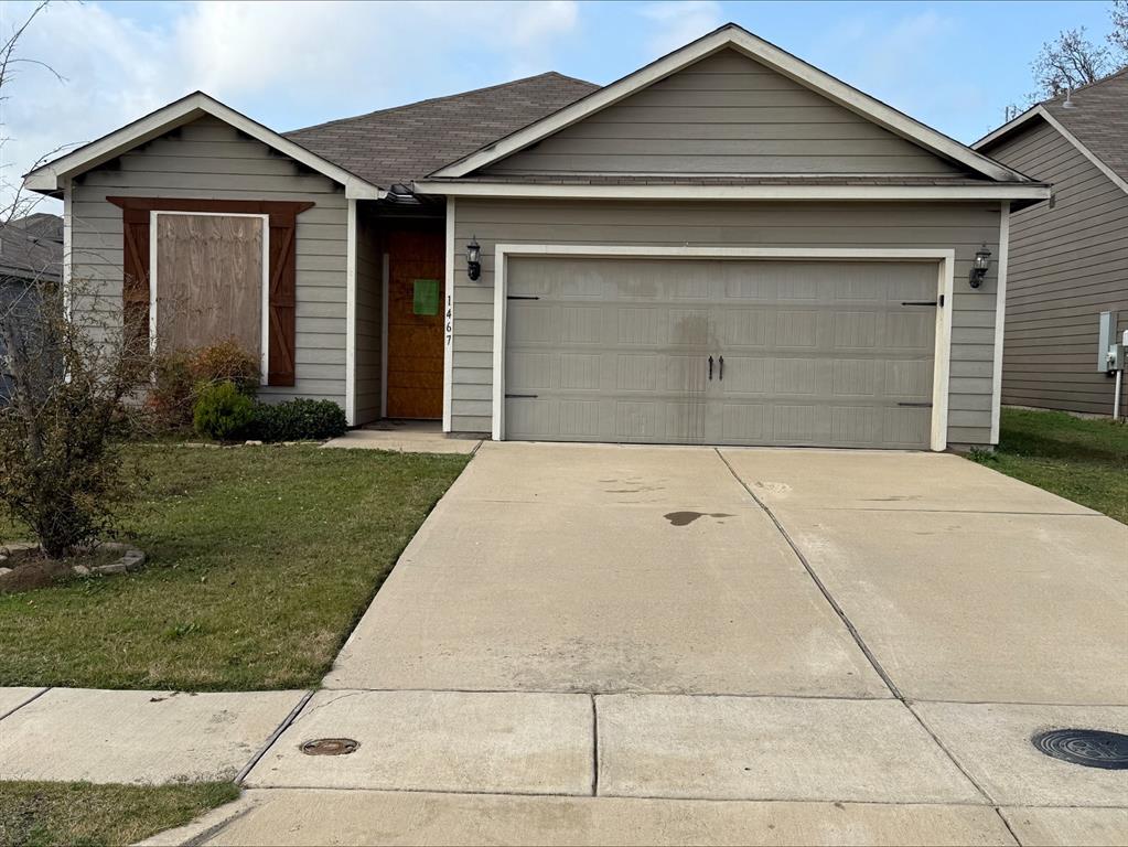 a front view of a house with garage