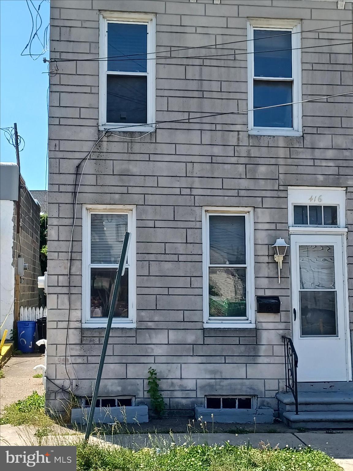 a brick house with a small yard