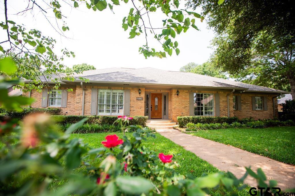 a front view of a house with yard