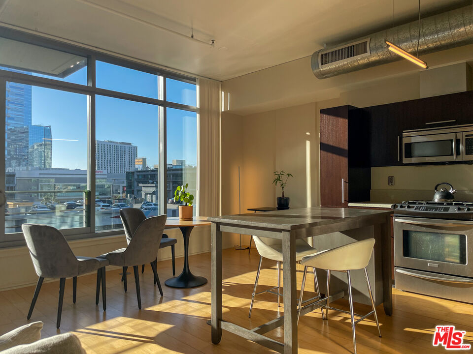 a view of a dining room with furniture window and outside view