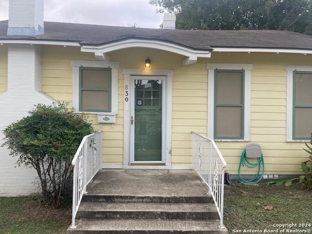 a front view of a house with a porch