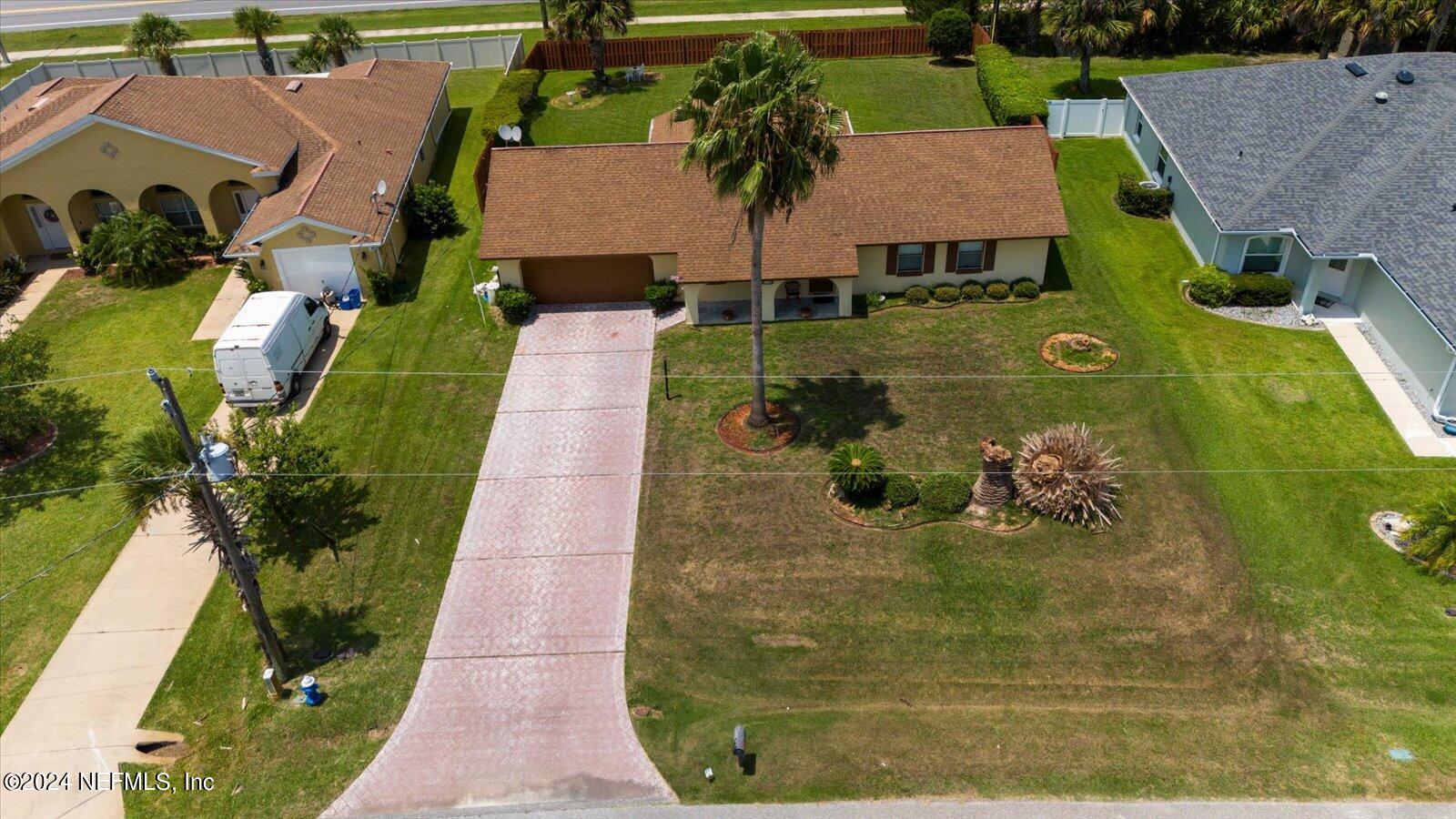 an aerial view of residential house with outdoor space