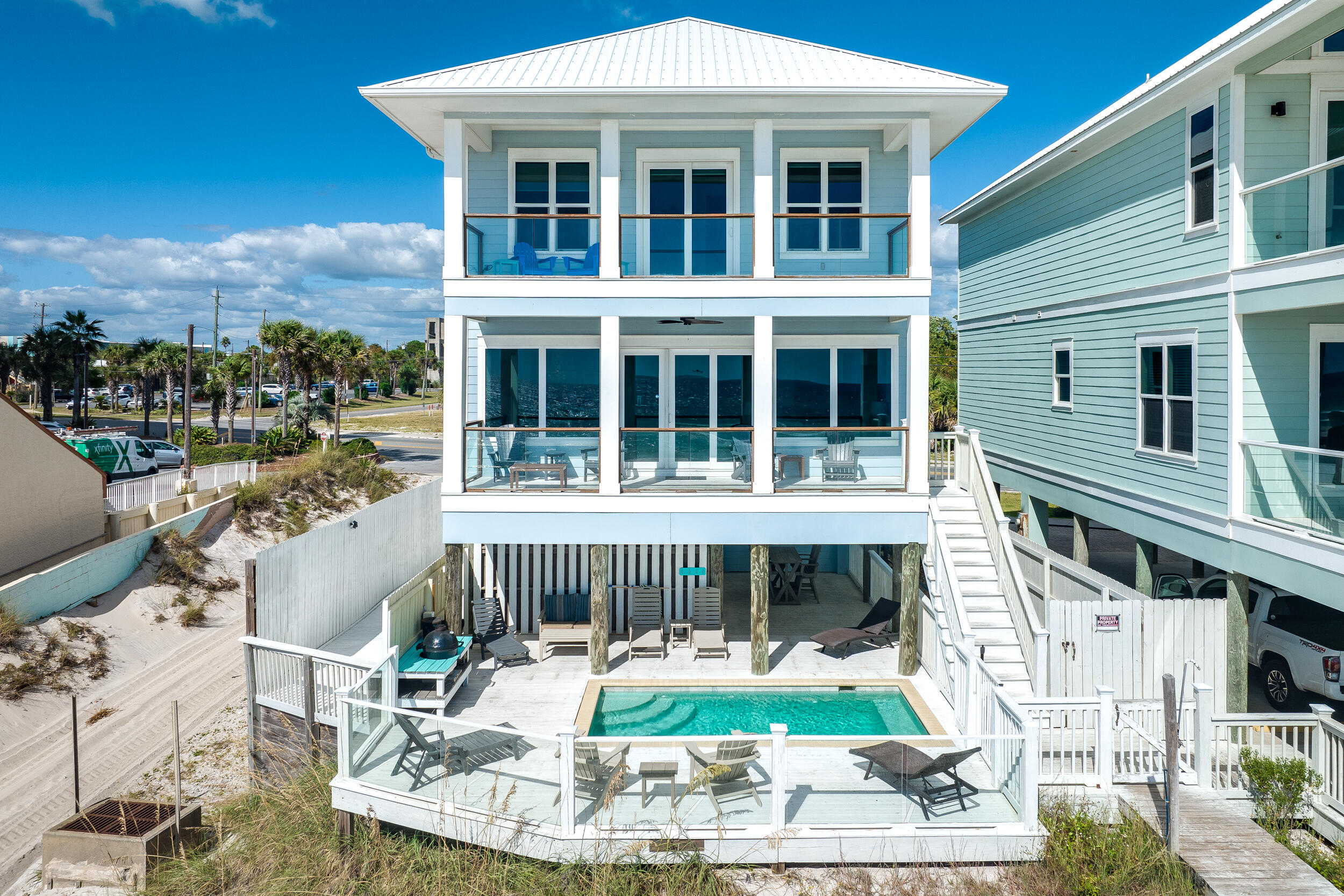 a view of house with a chairs in patio