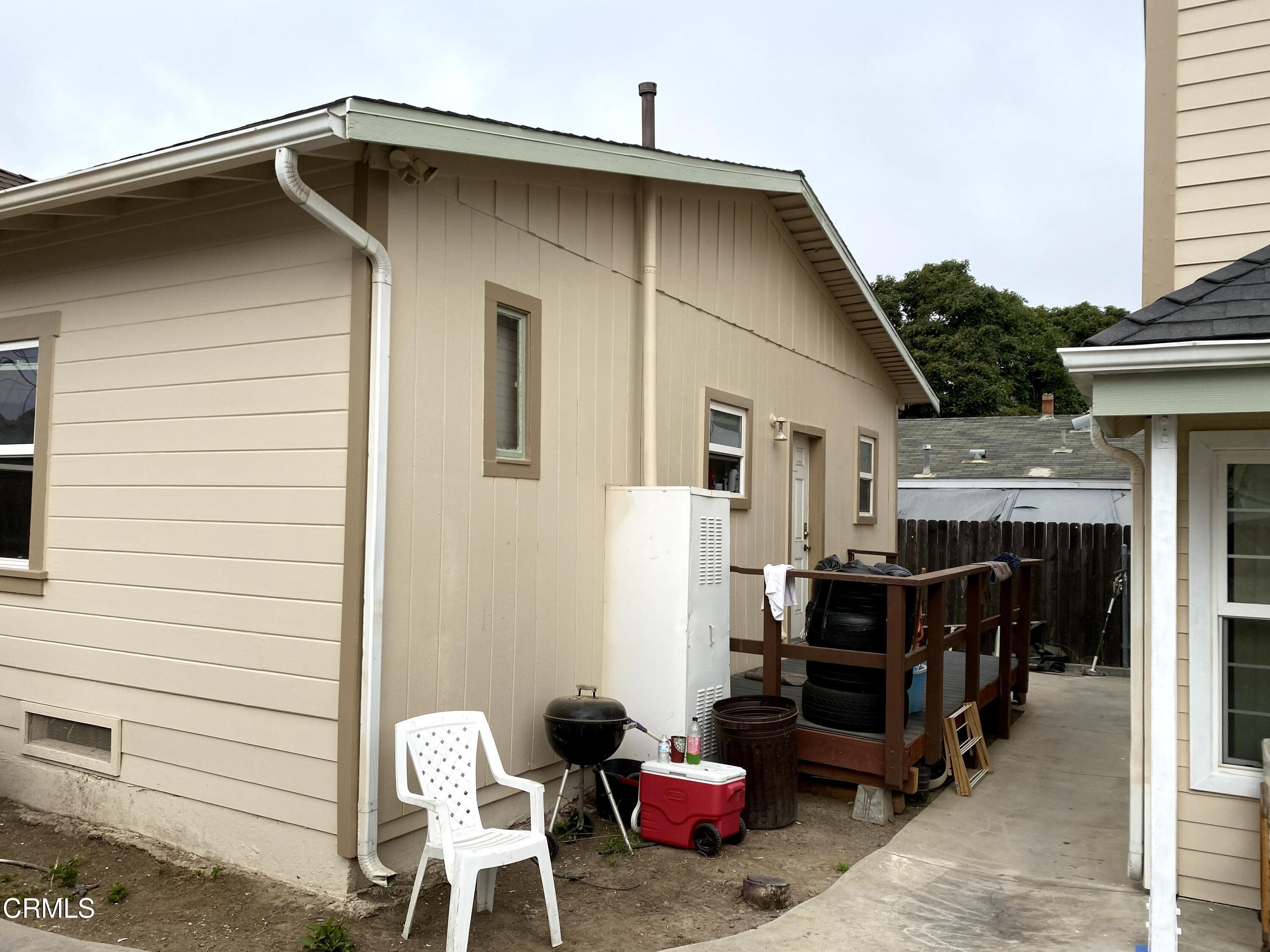 a front view of house with outdoor seating