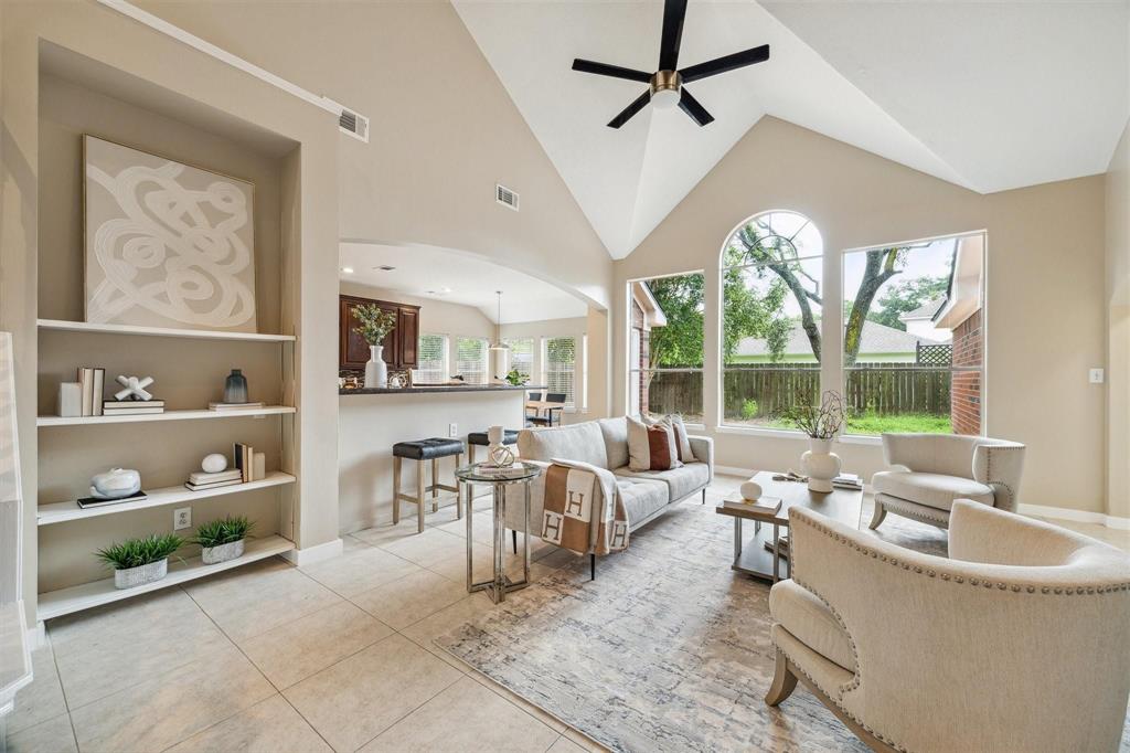 a living room with furniture large window and wall view