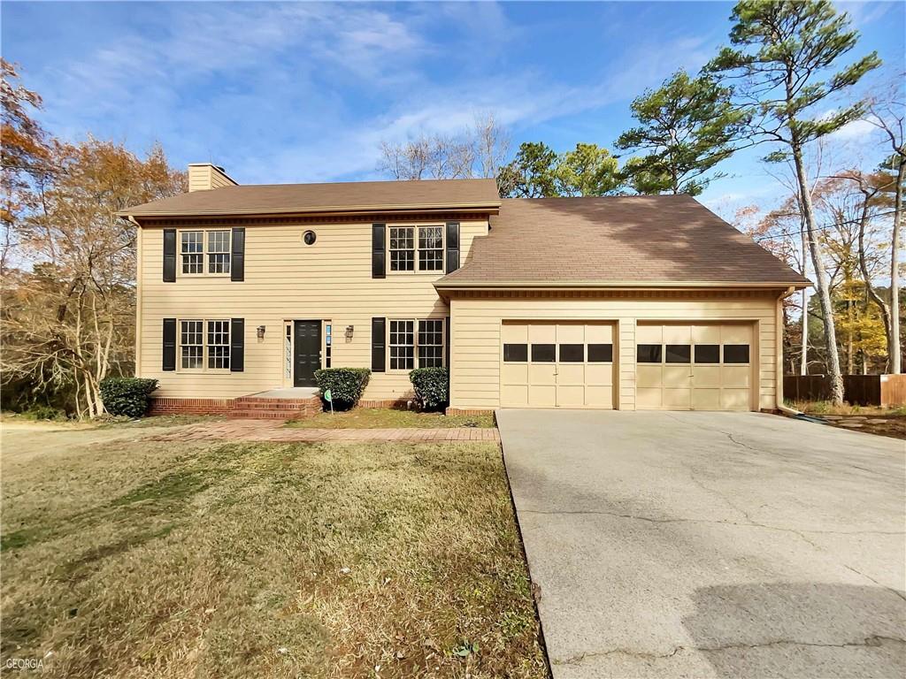 front view of a house with a yard