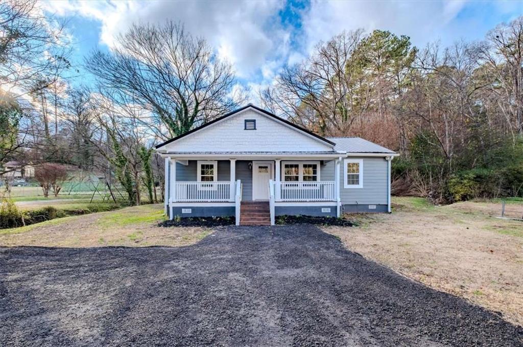 a house with trees in the background