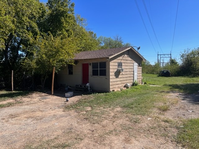 a front view of house with yard and trees