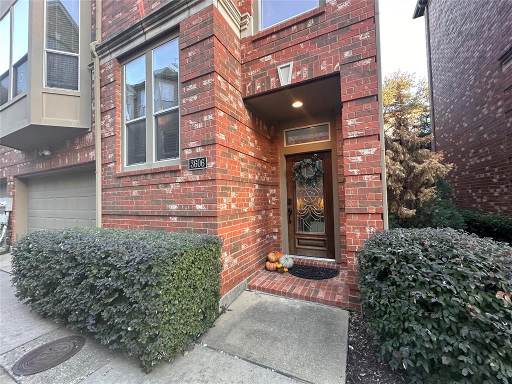 a view of a brick house with a large windows