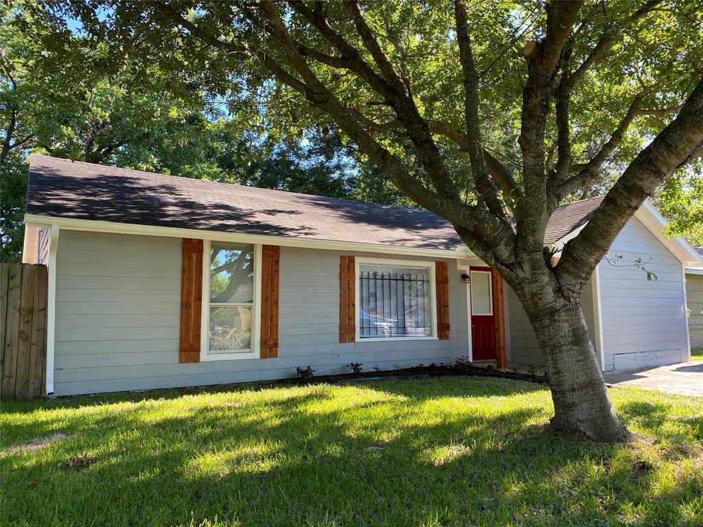 a house with a large tree in front of it