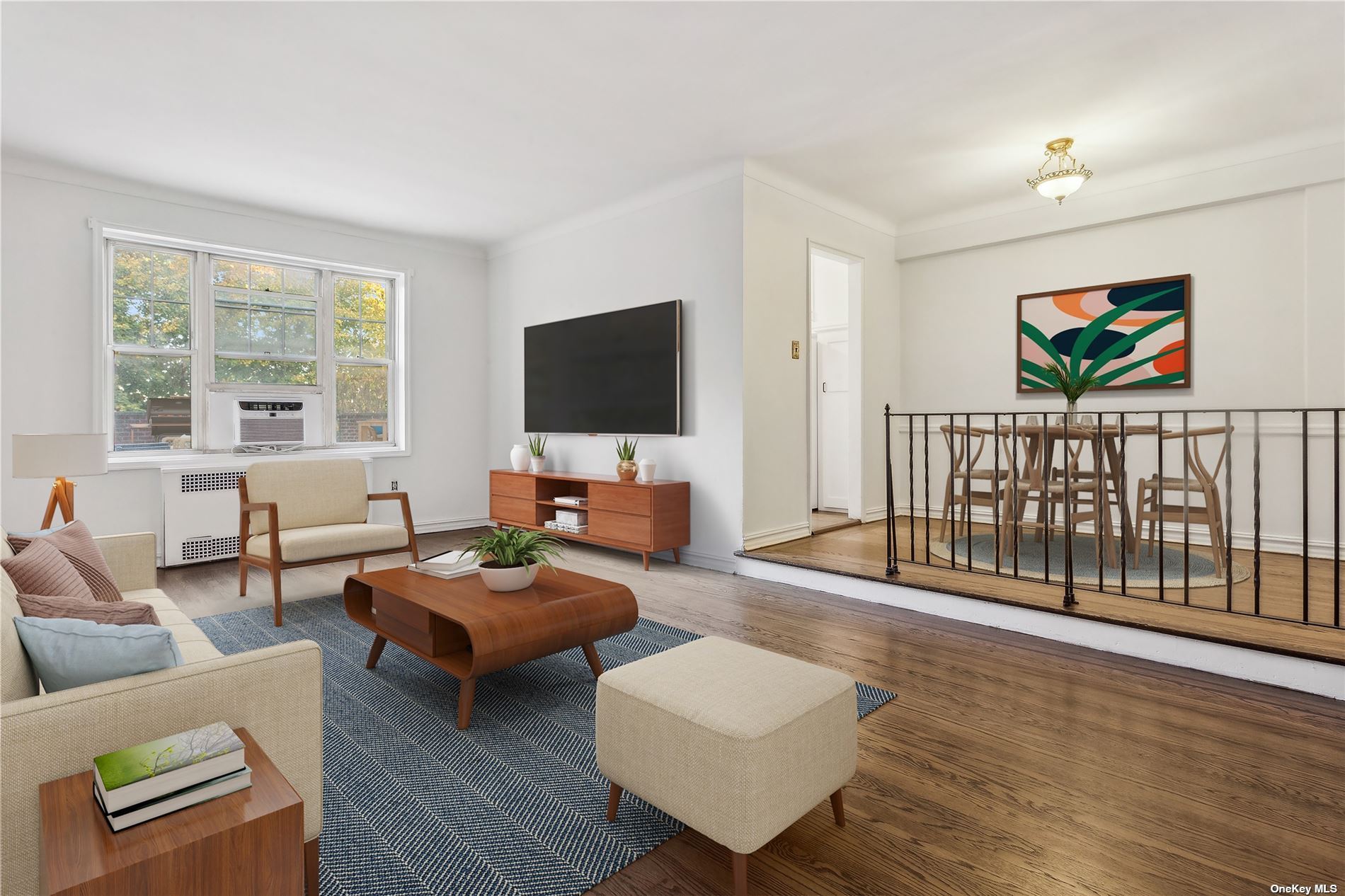 a living room with furniture a flat screen tv and a large window