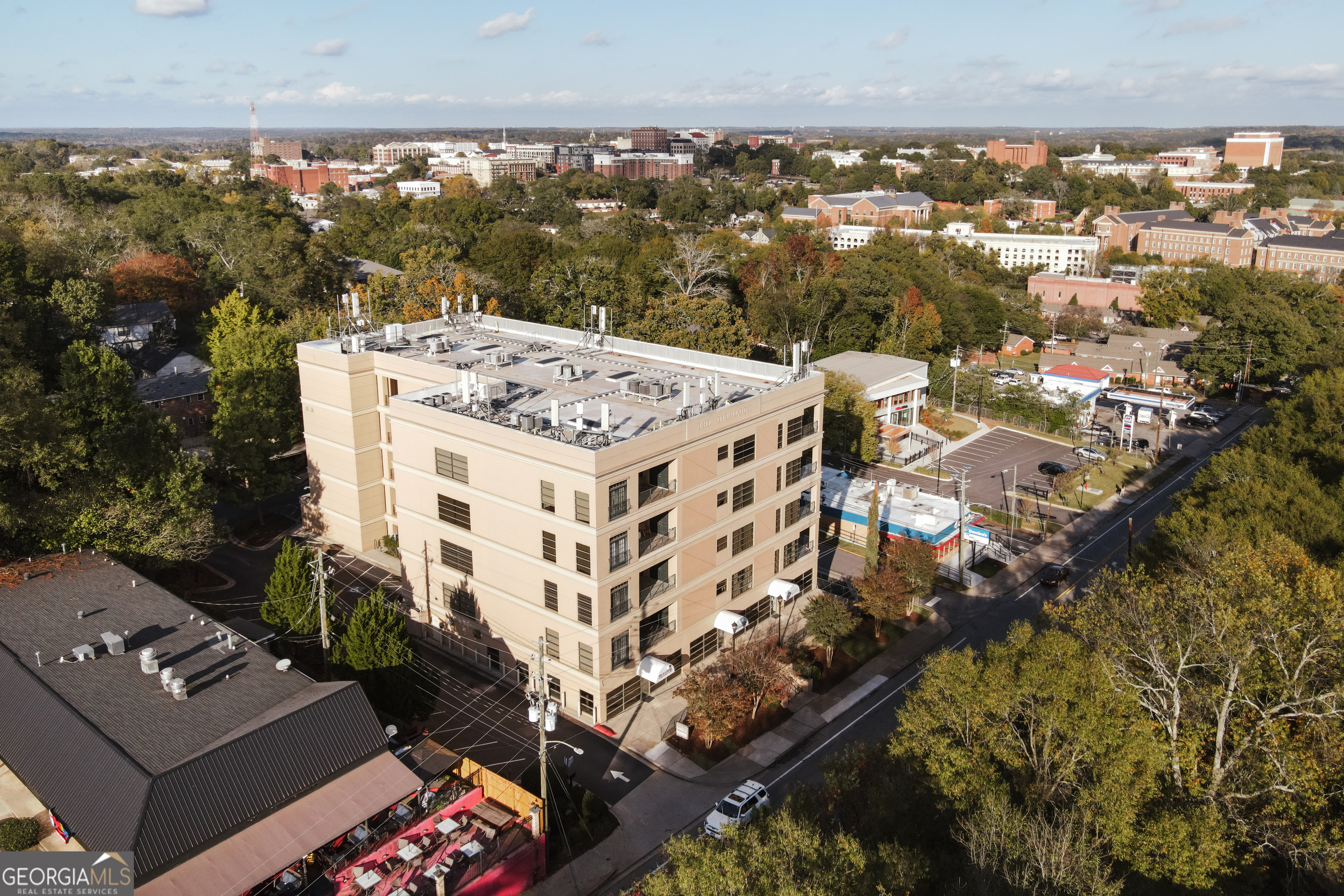 an aerial view of a building with an outdoor space