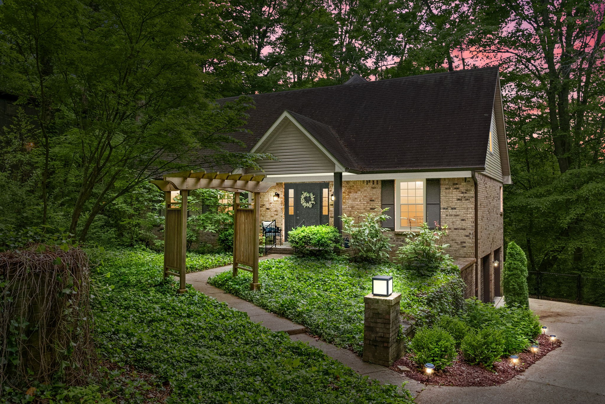 a front view of a house with garden