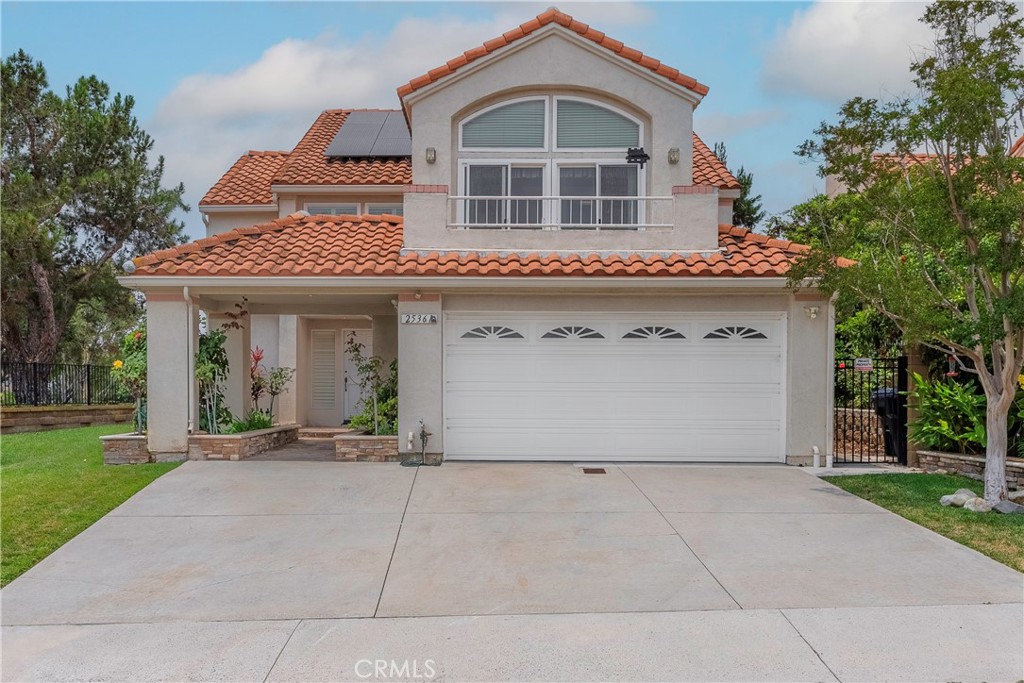 a front view of a house with a outdoor space