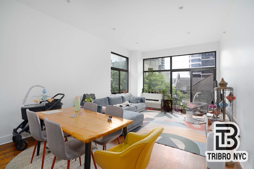 a view of a livingroom with furniture and window