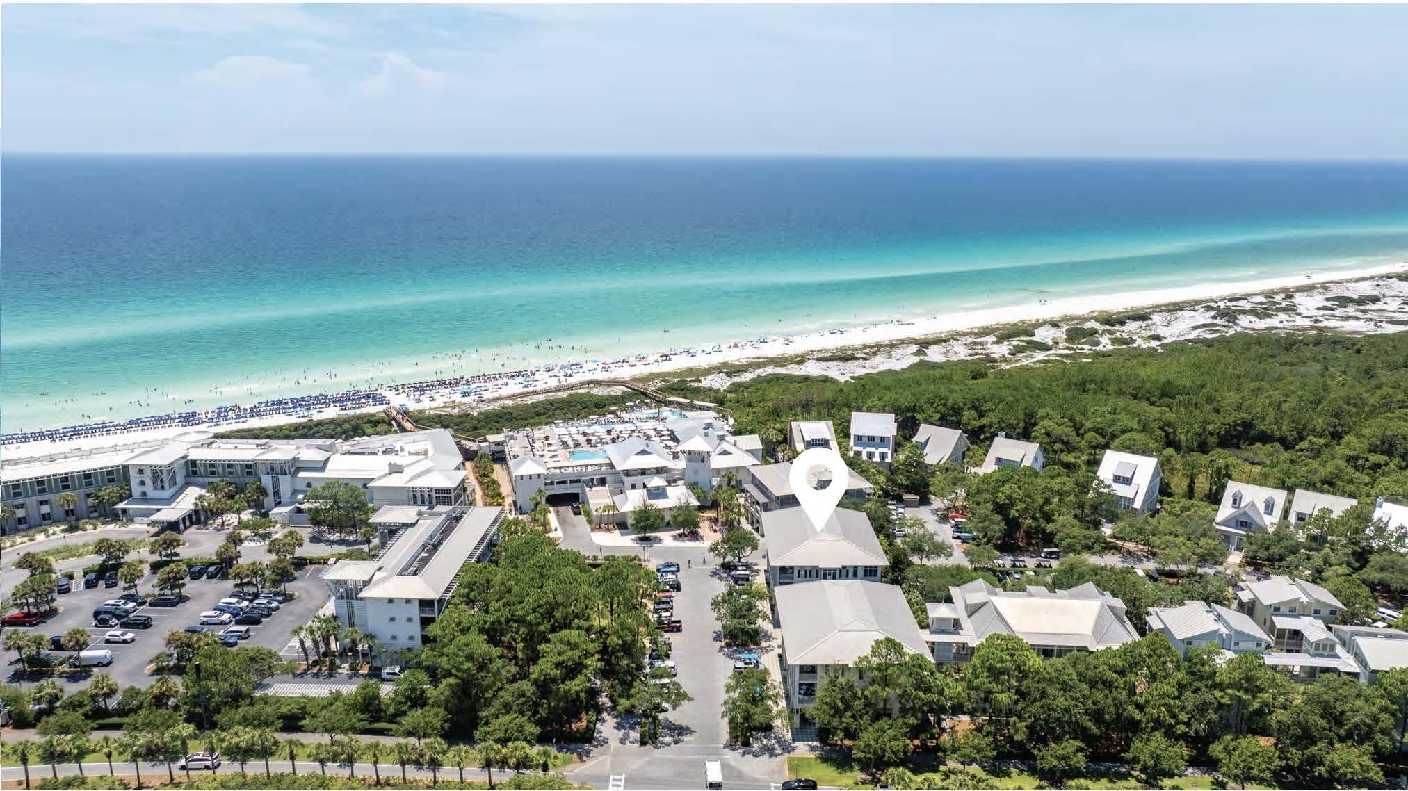 an aerial view of residential building and ocean