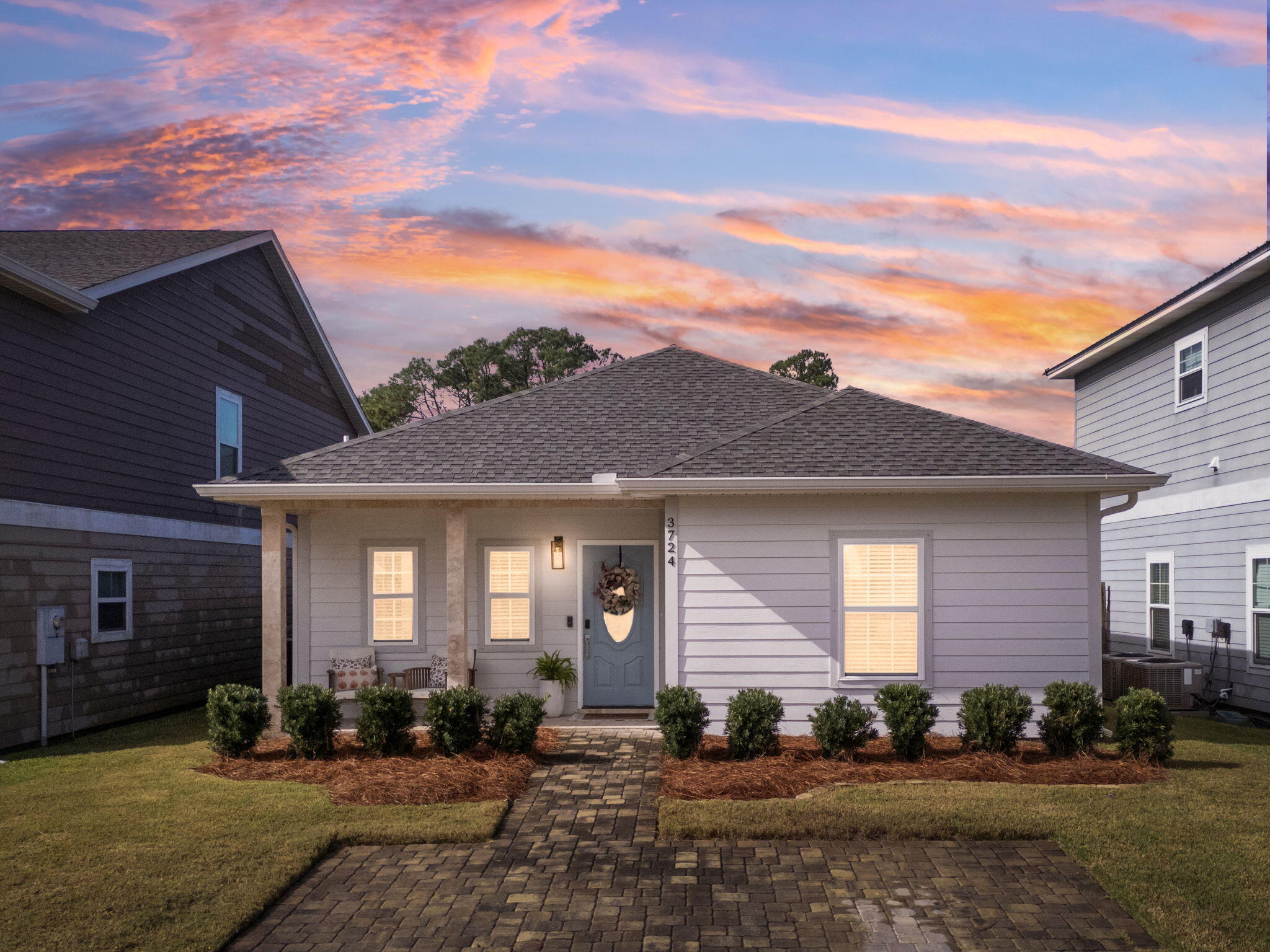 a front view of a house with a yard