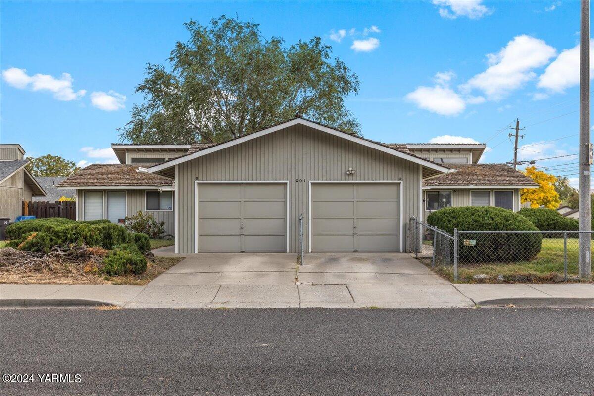 a house that has a tree in front of it