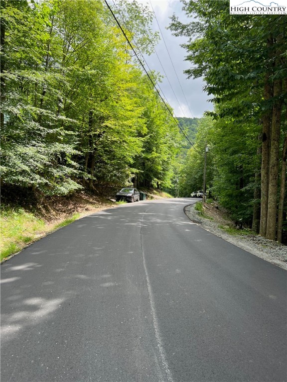 a view of a road with a yard