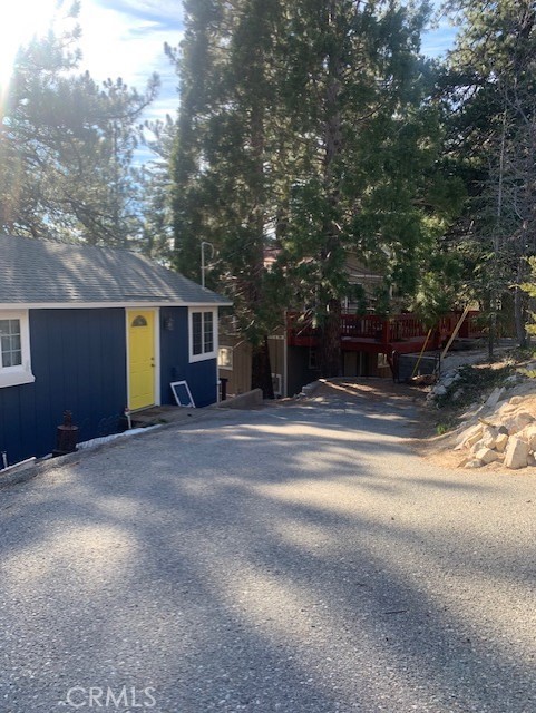 a view of a house with a yard and garage