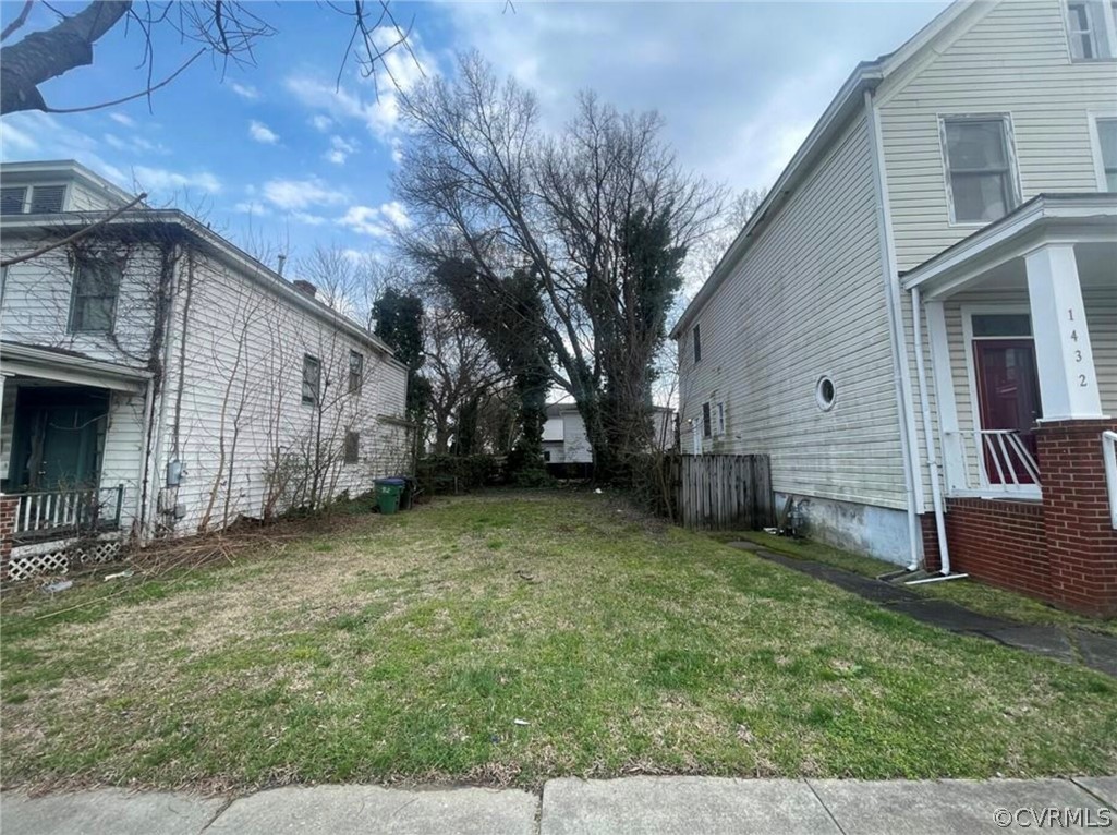 a view of a backyard with a large tree