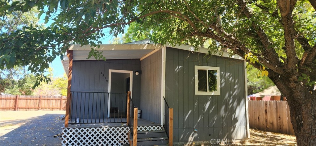 a view of a house with a tree