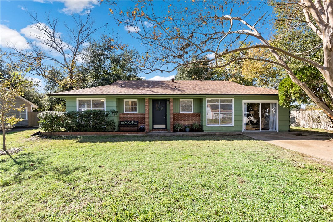 Single story home featuring a front yard