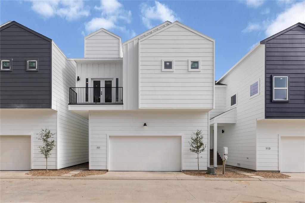 a front view of a house with a garage