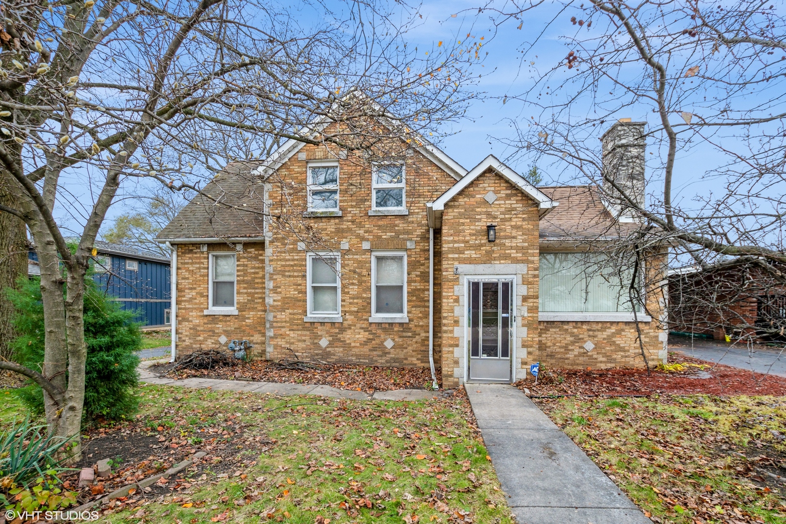 front view of a house with a yard