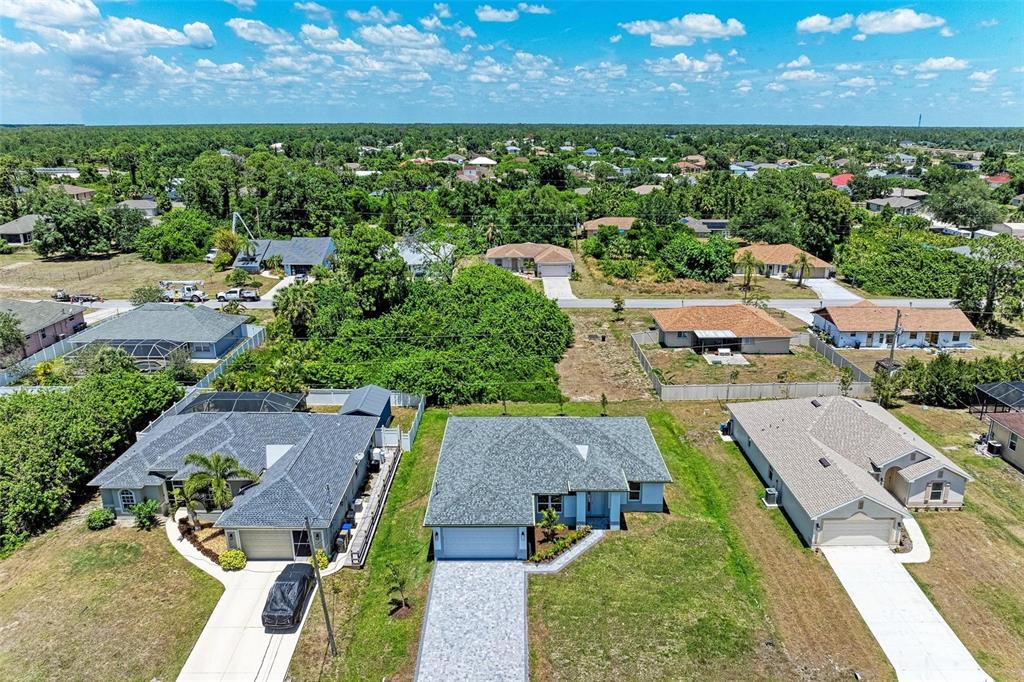 an aerial view of a house with a garden