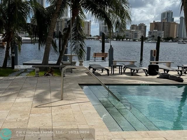 a view of a swimming pool with a patio