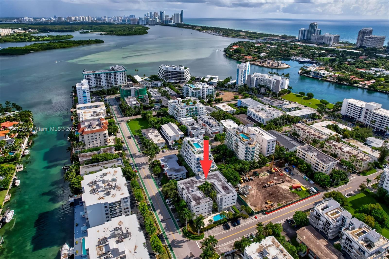 an aerial view of a house with a lake view