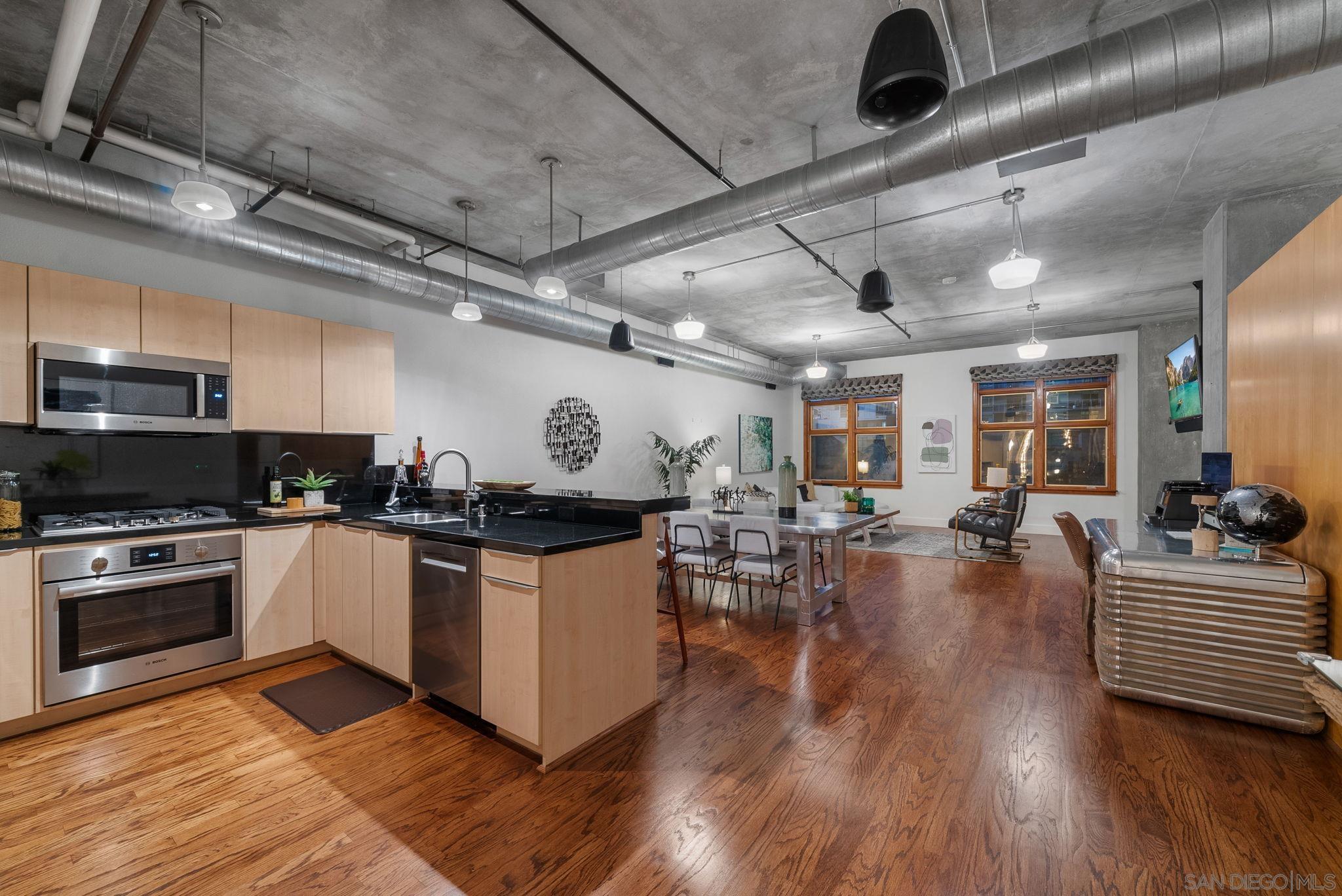 a kitchen with sink stove and cabinets