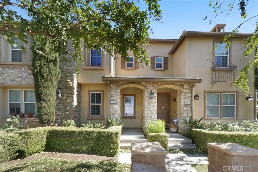 front view of a house with a garden