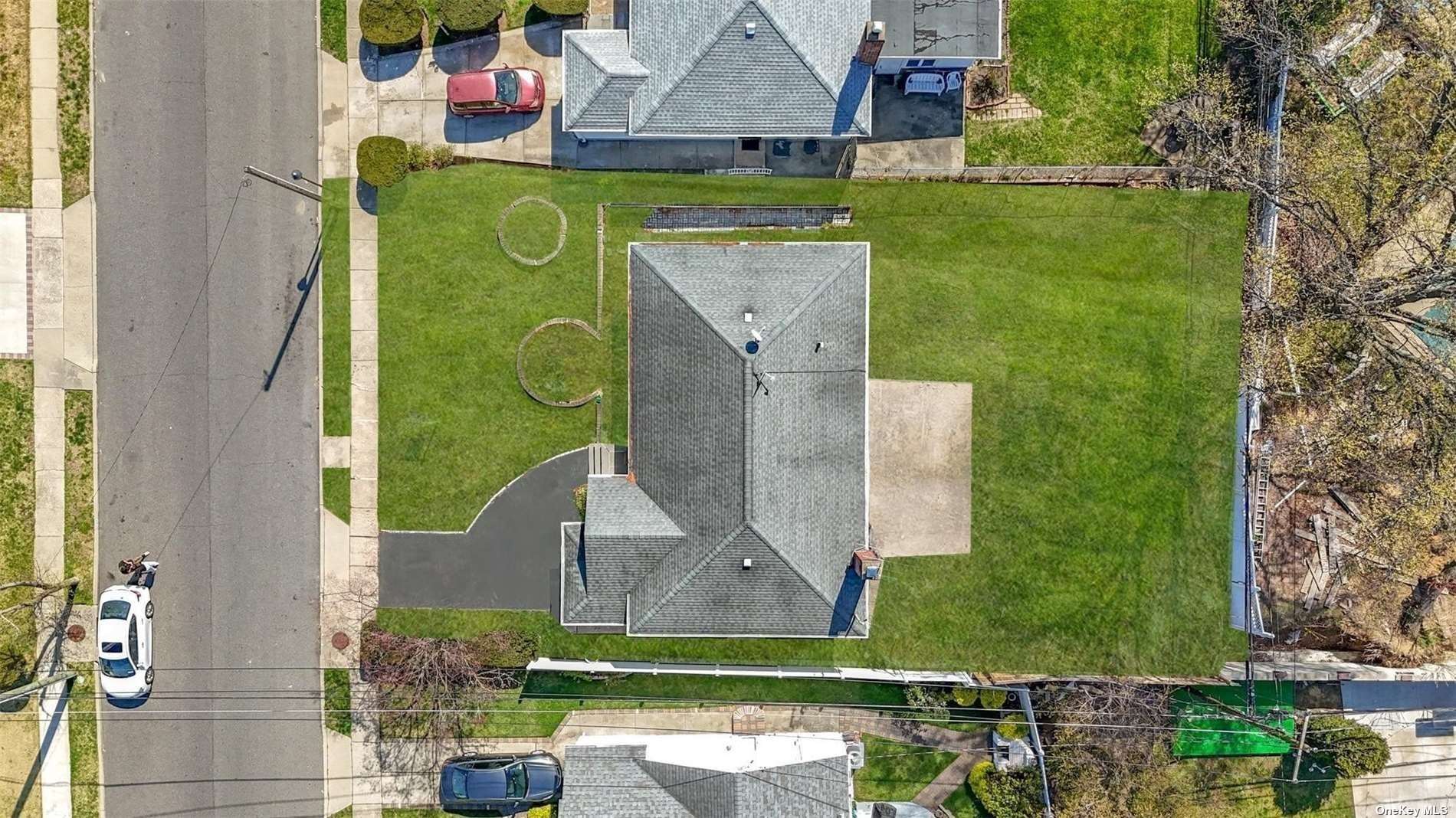 an aerial view of a house with a garden