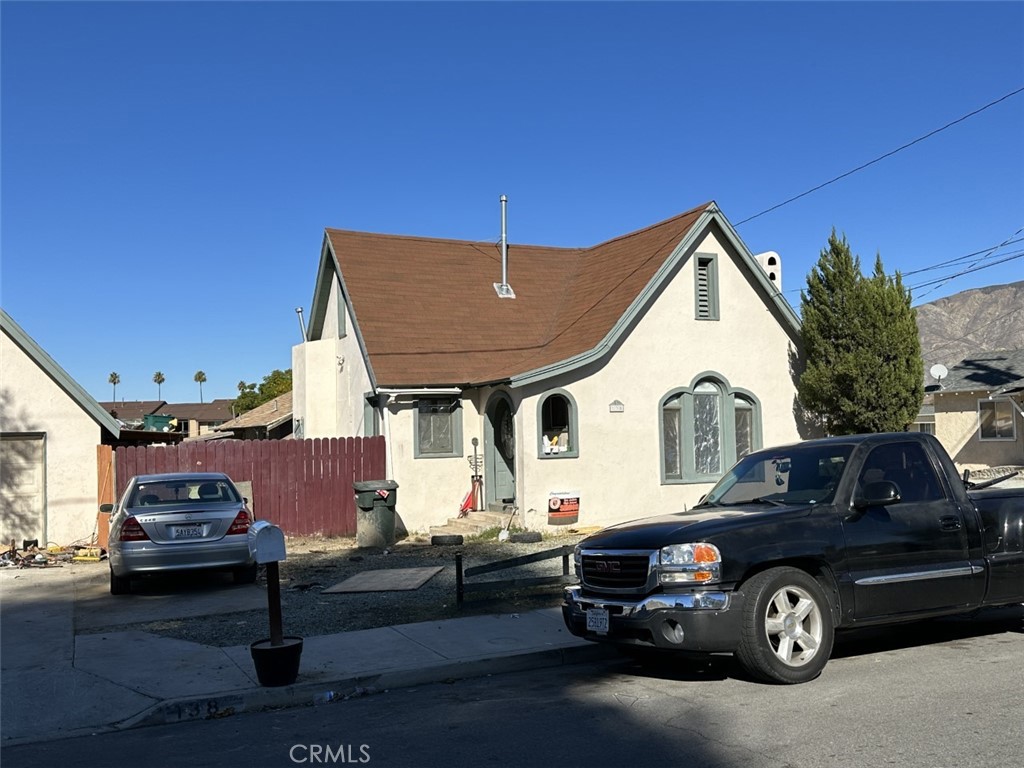 a front view of a house with parking space