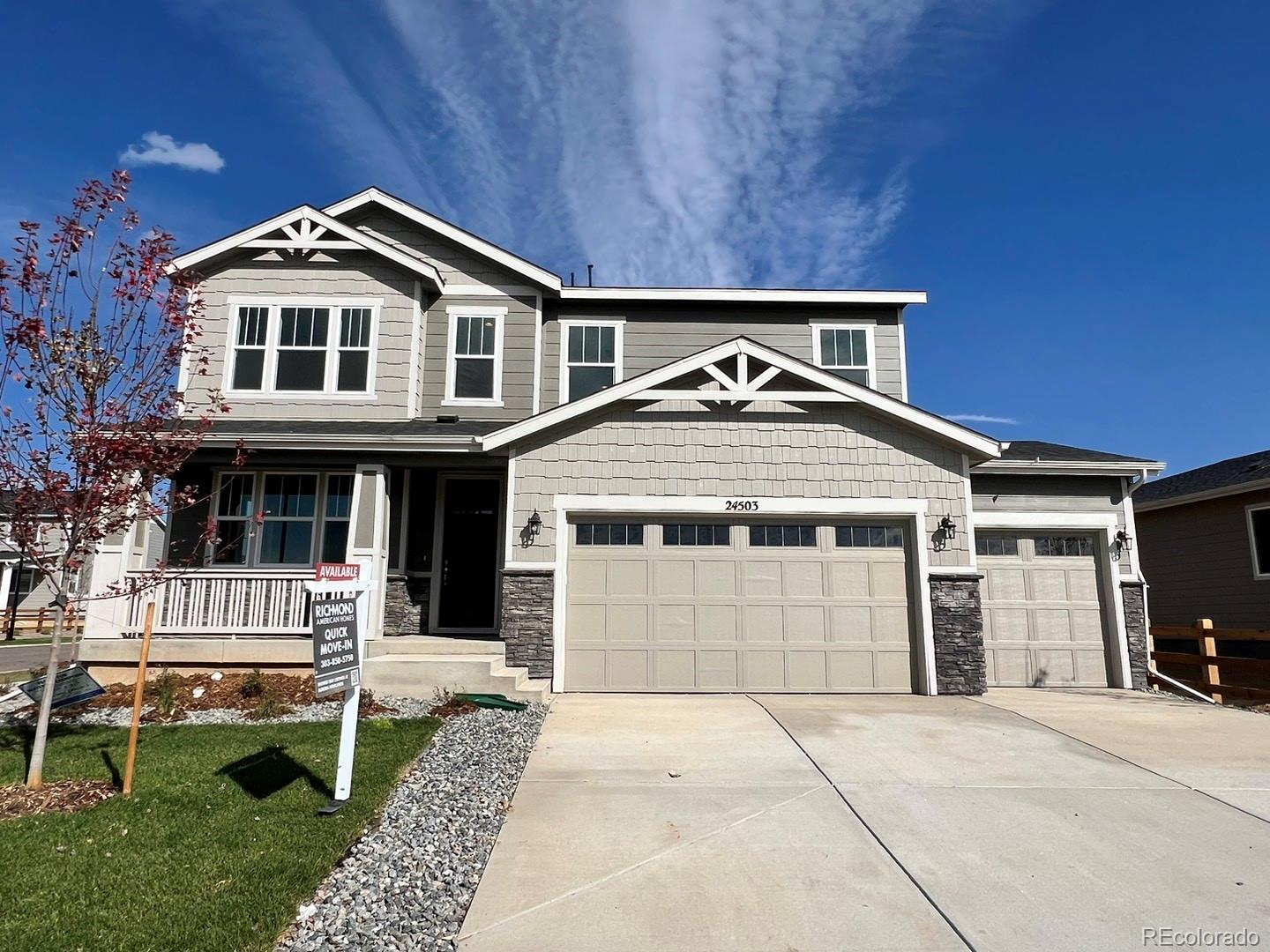 a front view of a house with a garage