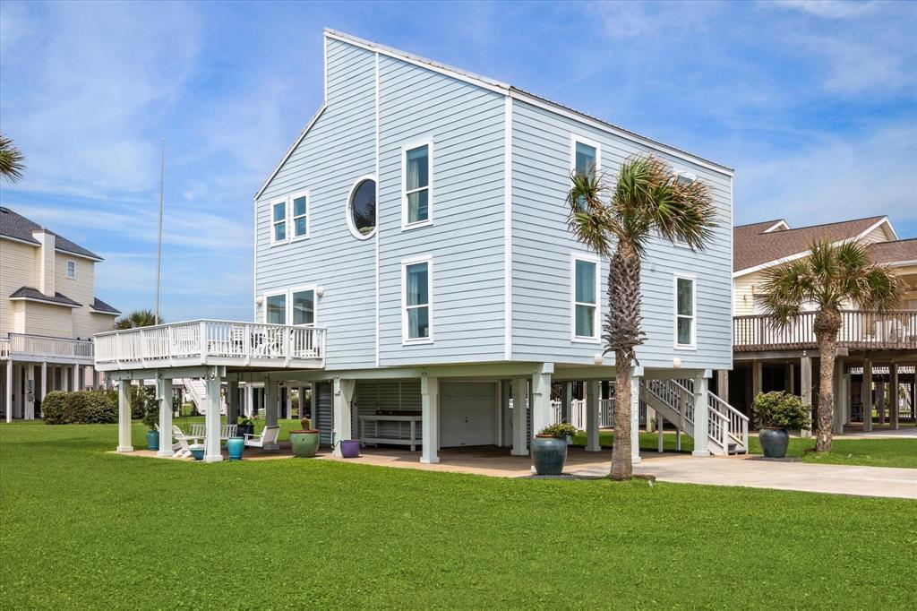 a front view of a building with a garden