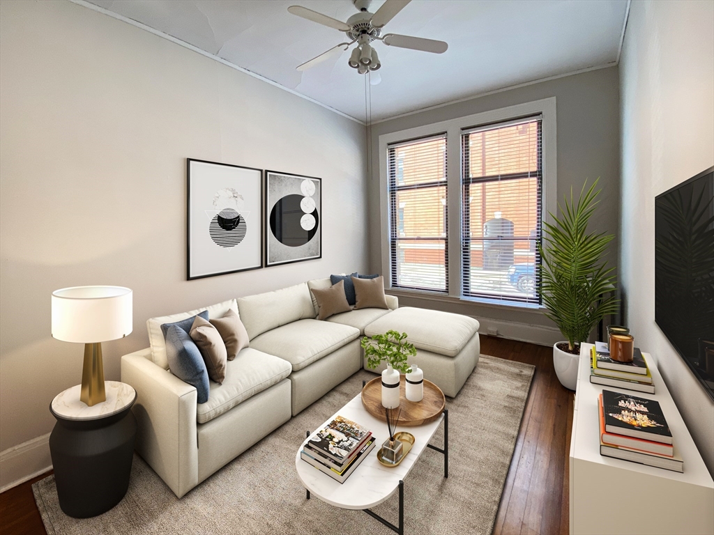 a living room with furniture and a flat screen tv