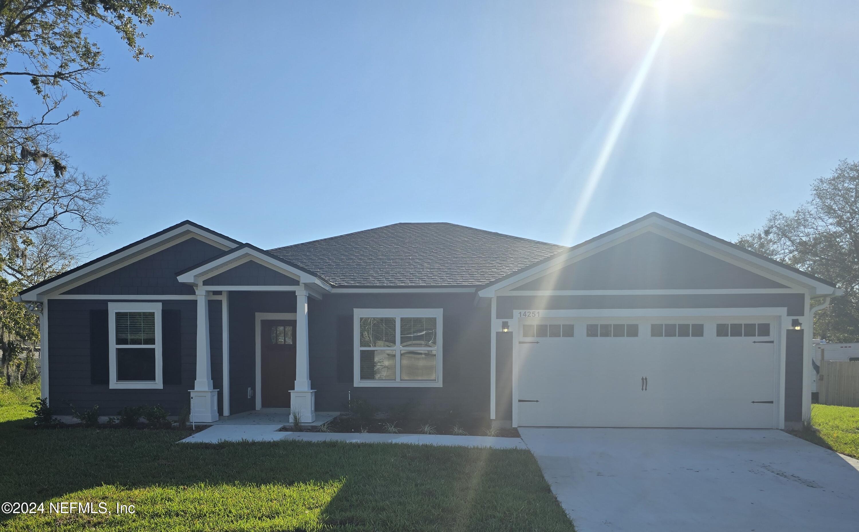 front view of a house with a yard