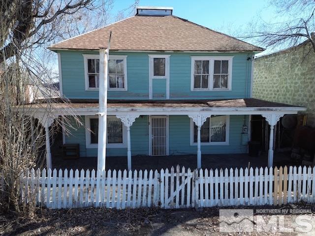 a front view of a house with a fence