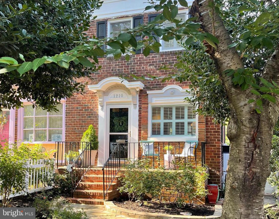 front view of a house with a garden