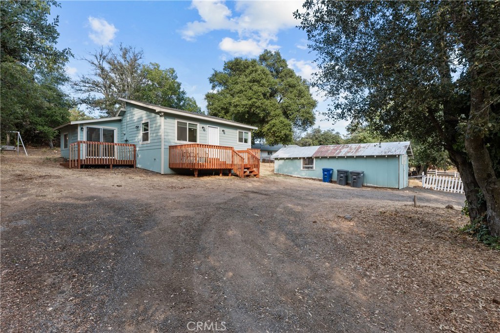 a front view of house with yard and trees