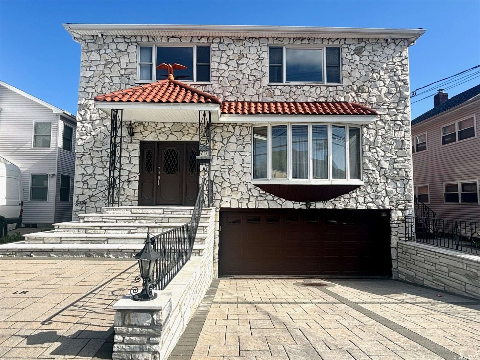 a front view of a house with a balcony